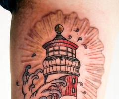 Lighthouse tattoo on skin