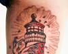 Lighthouse tattoo on skin