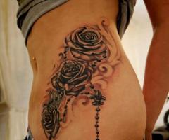 Rose and rosary tattoo