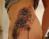 Rose and rosary tattoo