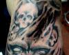 Tatuaje de demonio y calaveras