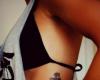 Feminine anchor tattoo on ribs