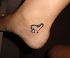 Double heart tattoo