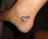 Double heart tattoo