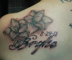 Name and flower tattoo