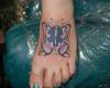 Butterfly foot tattoo