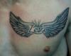 Wings dedication tattoo