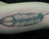 Feather tattoo by Kris VanLeuven