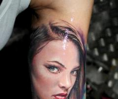 Portrait of girl with rose tattoo