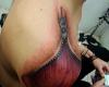 Tatuaje de cierre éclair o cremallera