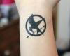 The hunger games logo tttoo