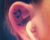 Tattoo de musica en la oreja