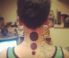 Circle tattoos on neck