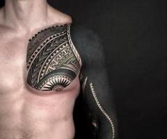 Black and decorative arm tattoo