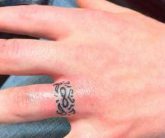 Symbol infinity commitment tattoo