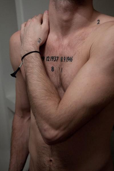 Some pretty number tattoo on chest