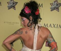 Pixie Acia back tattoos