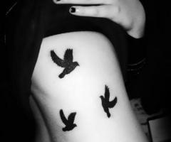 5 bird tattoo on ribs