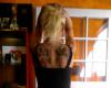 Blonde with wing tattoo