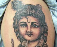 Hare krishna Tattoo on Arm in Black & Grey