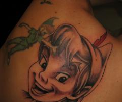 Peter Pan face tattoo