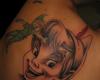 Peter Pan face tattoo