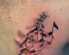 http://www.tattooset.com/images/tattoo/2012/12/07/13676-music-skin-tattoo_tiny.jpg