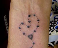Religious arm tattoo design