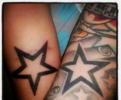 Friends with star tattoo