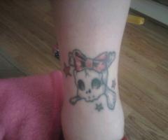 Girly skull leg tattoo