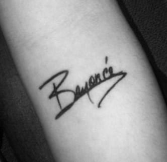 Beyoncé sign tattoo