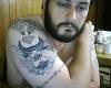 Desmond Miles Arm Tattoo