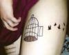 Aviary thigh tattoo