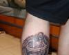 Tatuaje de angel en la pierna