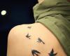 Seven Bird tattoo on back