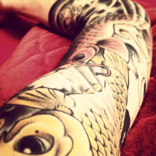 Koi Fish full arm tattoo