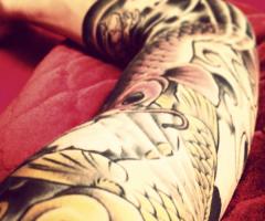 Koi Fish full arm tattoo