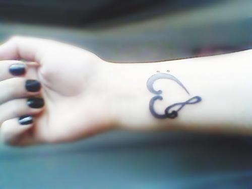 It a music heart with treble clef symbol