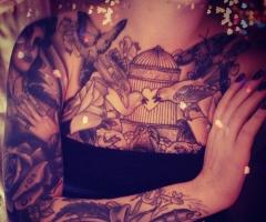 Birds and butterfly on chest