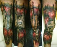 Biomechanical leg tattoo
