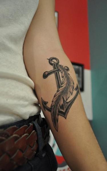 Anchor and feather tattoo