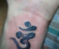 OM symbol tattoo