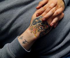 Skull hand tattoo