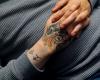 Skull hand tattoo