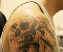 Ship and skull tattoo