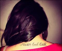 Brunette girl with quote tattoo