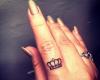 Crown finger tattoo