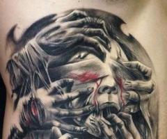 Manos zombies sobre rostro