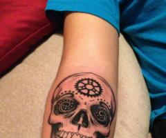 Skull arm tattoo