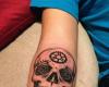 Skull arm tattoo